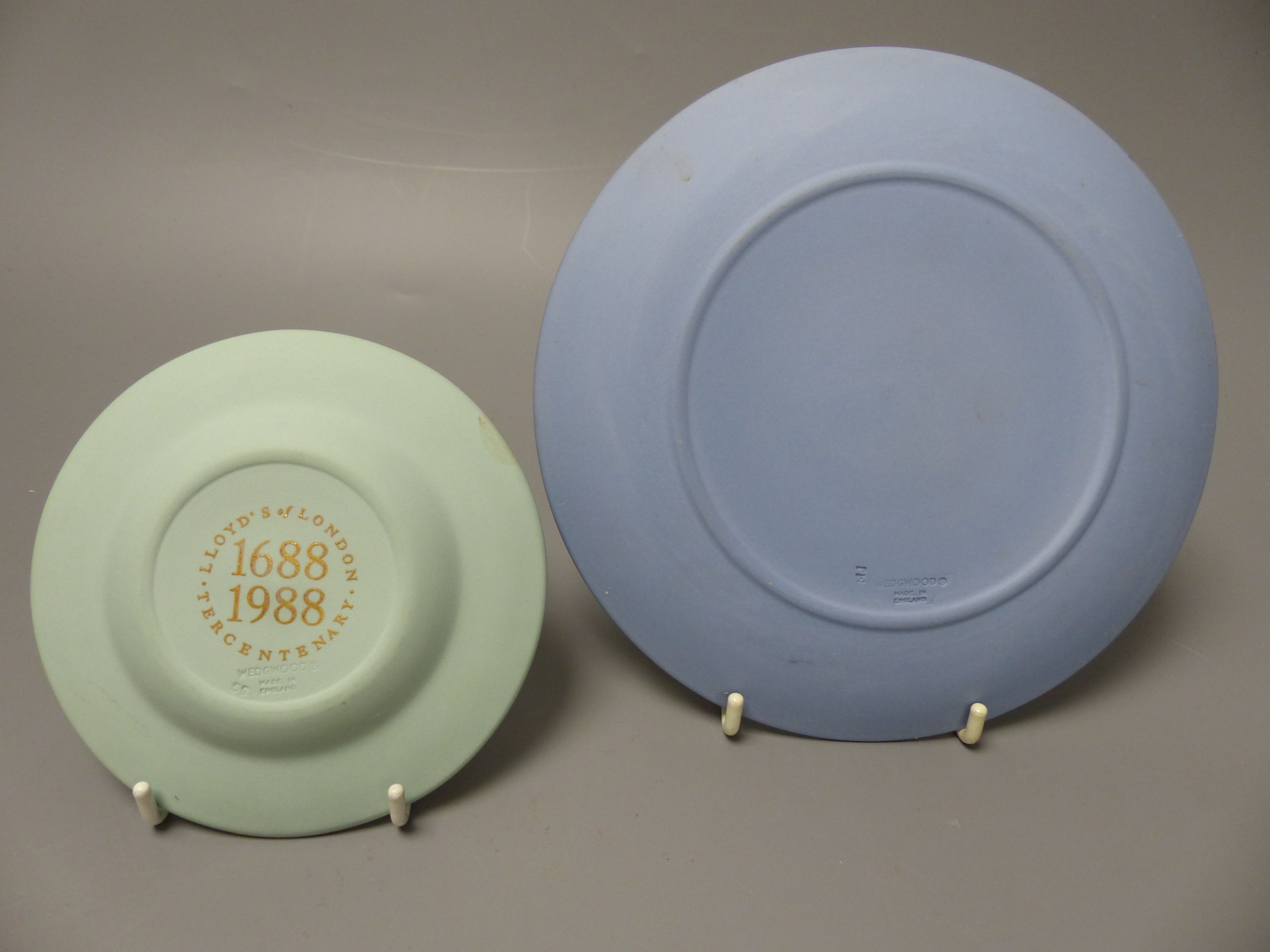 Four pieces of Wedgwood jasper wares including a pair of Victorian blue jasper vases, height 18.5cm, and later dish and pin dish